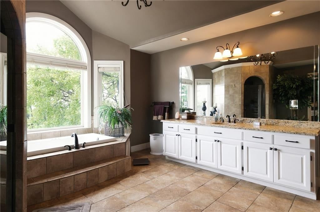 Freestanding tub and renovated bathrooms at 1205 NW 43rd Terrace, Kansas City, MO 64116