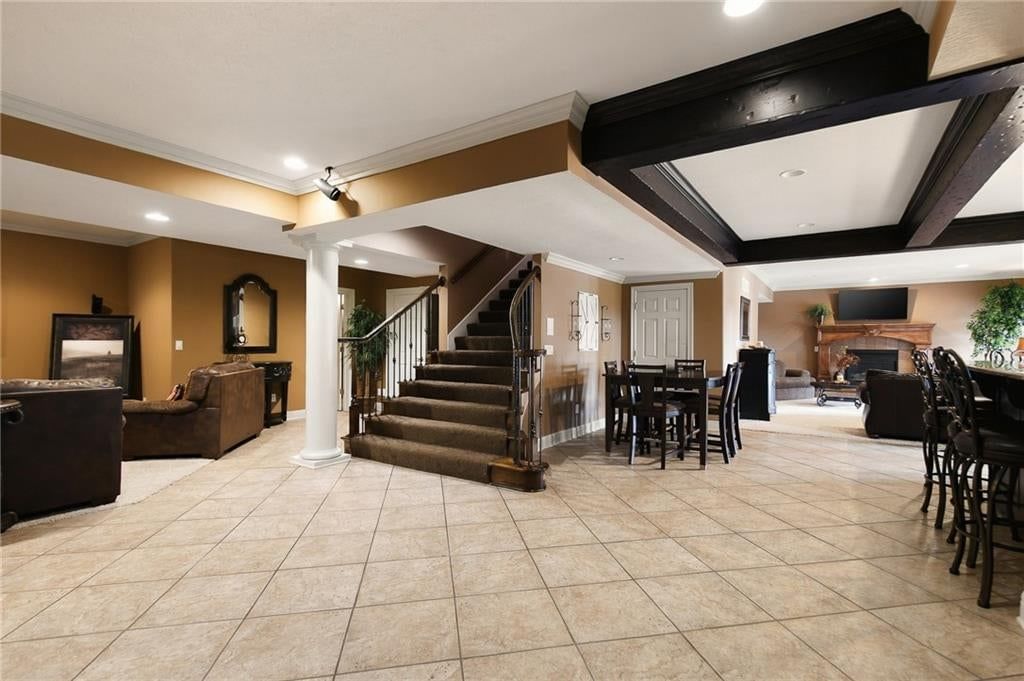 Open floor plan and coffered ceiling at 1205 NW 43rd Terrace, Kansas City, MO 64116