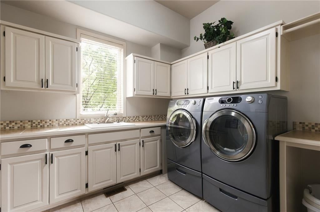 Laundry cabinets at 1205 NW 43rd Terrace, Kansas City, MO 64116