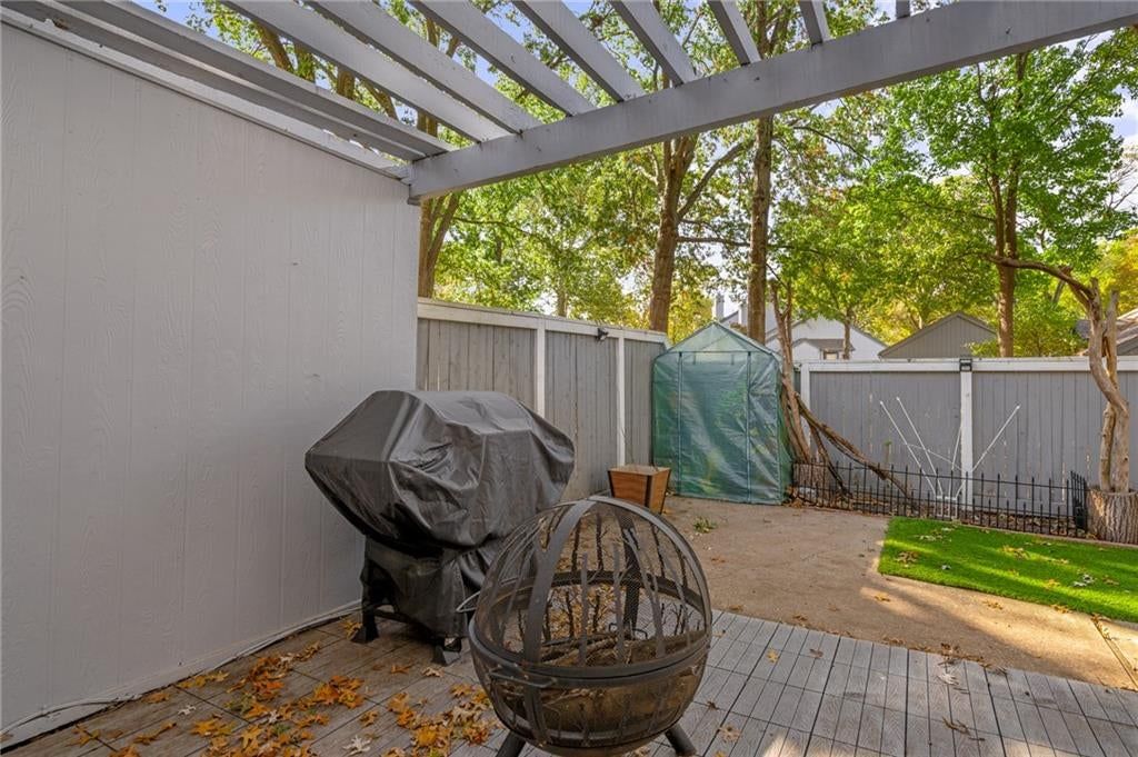 Covered patio and vinyl fence at 7900 Colony Lane, Lenexa, KS 66215