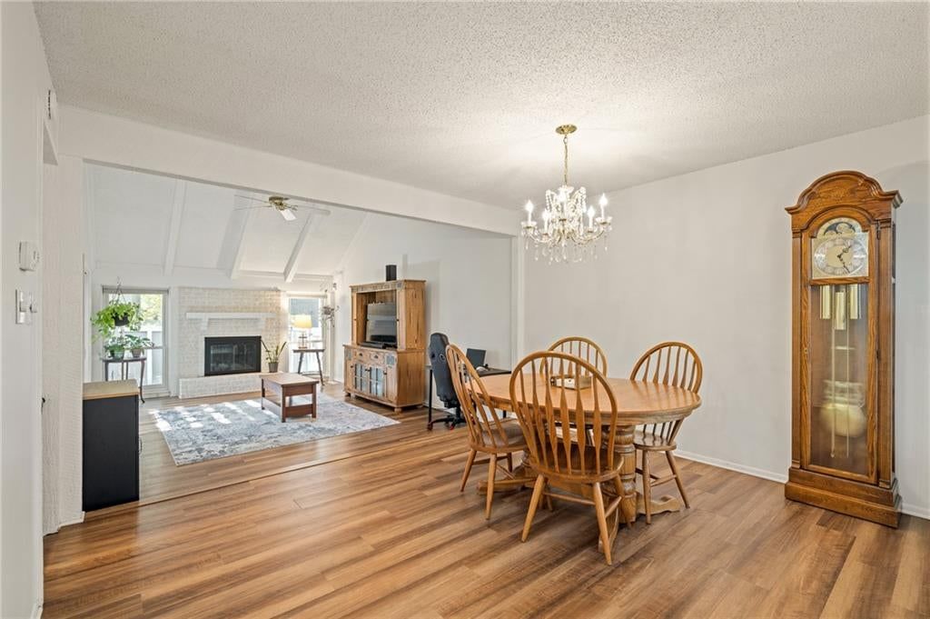 Hardwood floors, statement lighting and white trim at 7900 Colony Lane, Lenexa, KS 66215