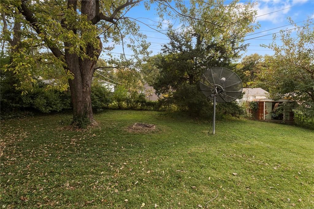 Big backyard and mature trees at 4509 W 75th Street, Prairie Village, KS 66208