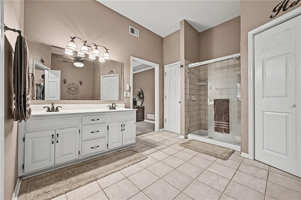 Walk-in shower and frameless glass shower at 21711 W 51st Place, Shawnee, KS 66226