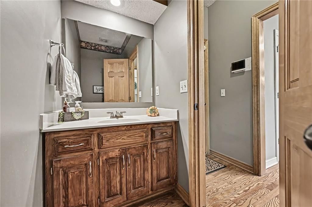 Double vanity, wood vanity and renovated bathrooms at 21711 W 51st Place, Shawnee, KS 66226