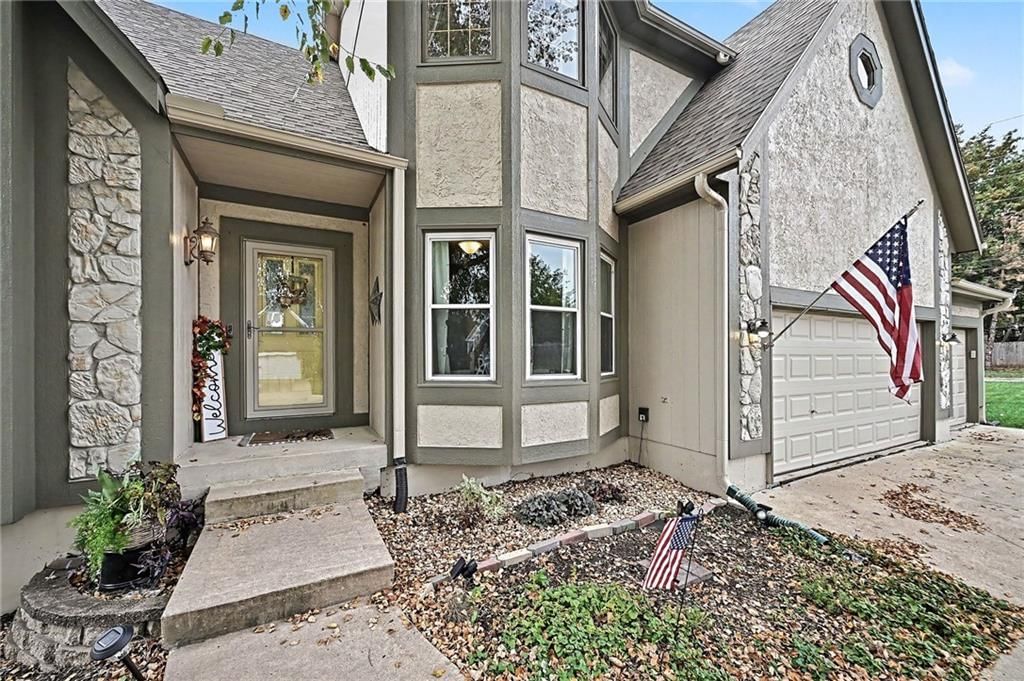 Covered front porch and attached garage at 21711 W 51st Place, Shawnee, KS 66226