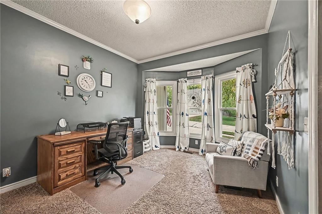 Main-floor primary bedroom, bedroom sitting area and walk-in closet at 21711 W 51st Place, Shawnee, KS 66226
