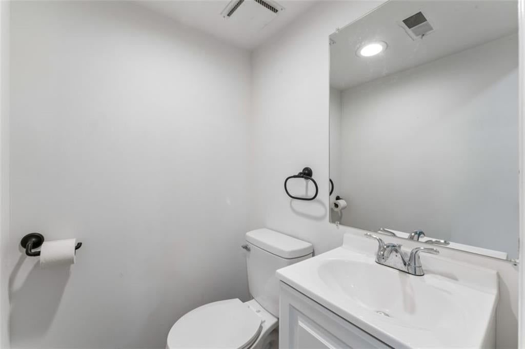 White vanity and renovated bathrooms at 417 N Jefferson Avenue, Liberty, MO 64068