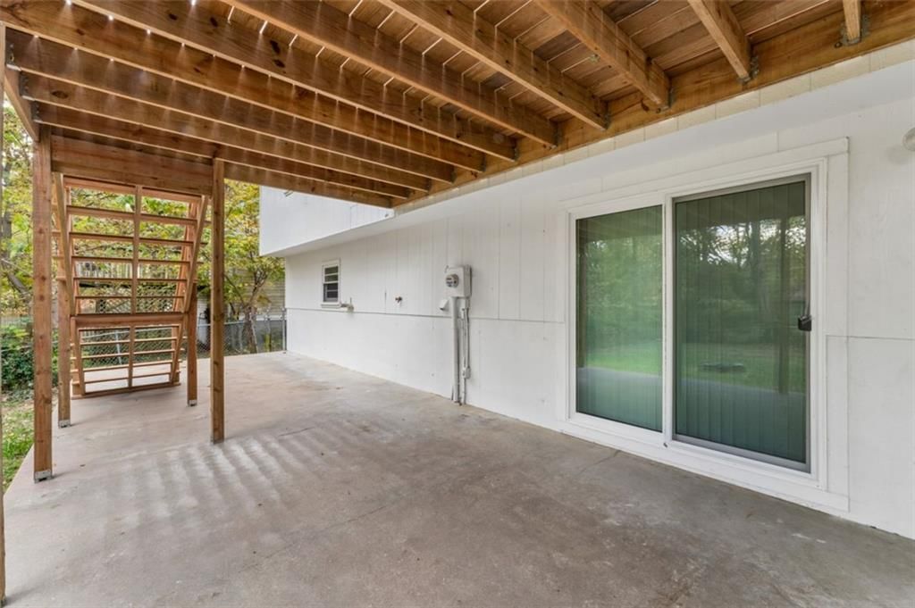 Covered patio and concrete patio at 417 N Jefferson Avenue, Liberty, MO 64068