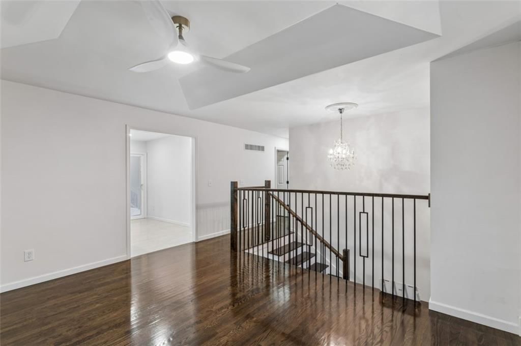 Tall ceilings and iron stair railing at 417 N Jefferson Avenue, Liberty, MO 64068