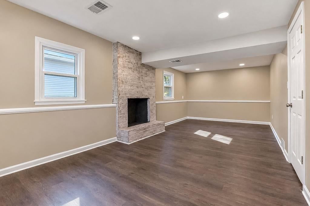 Fireplace, wainscoting or board and batten and stone fireplace at 6516 Ballentine Street, Shawnee, KS 66203
