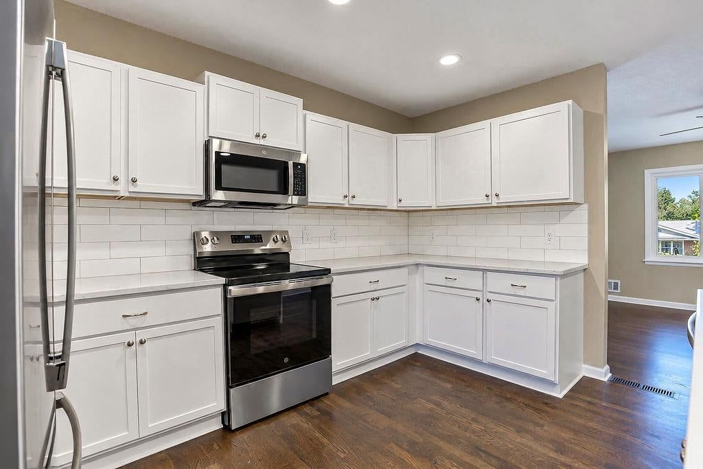 Stainless steel appliances, electric range and brushed nickel hardware at 6516 Ballentine Street, Shawnee, KS 66203