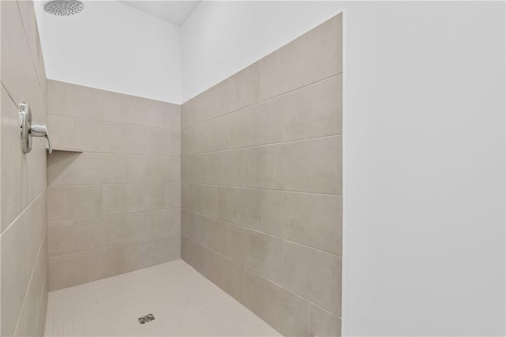 Walk-in shower and tiled shower at 21276 Cleveland Street, Spring Hill, KS 66083