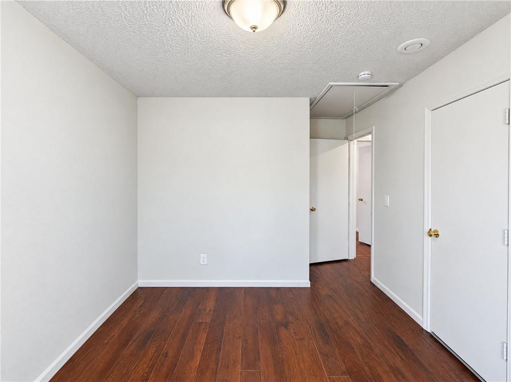 Hardwood floors and walk-in closet at 14416 Saint Andrews Drive, Grandview, MO 64030