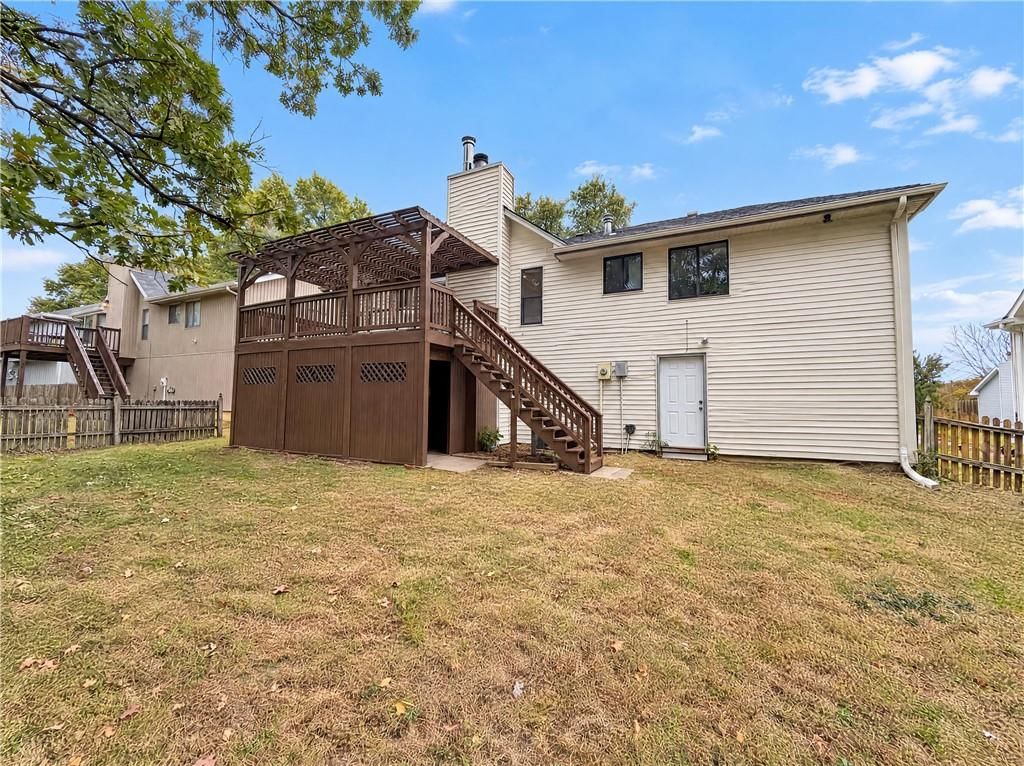 Big backyard, fenced yard and attached garage at 14416 Saint Andrews Drive, Grandview, MO 64030